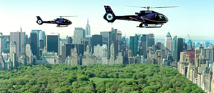 An image of helicopters above a New York skyline